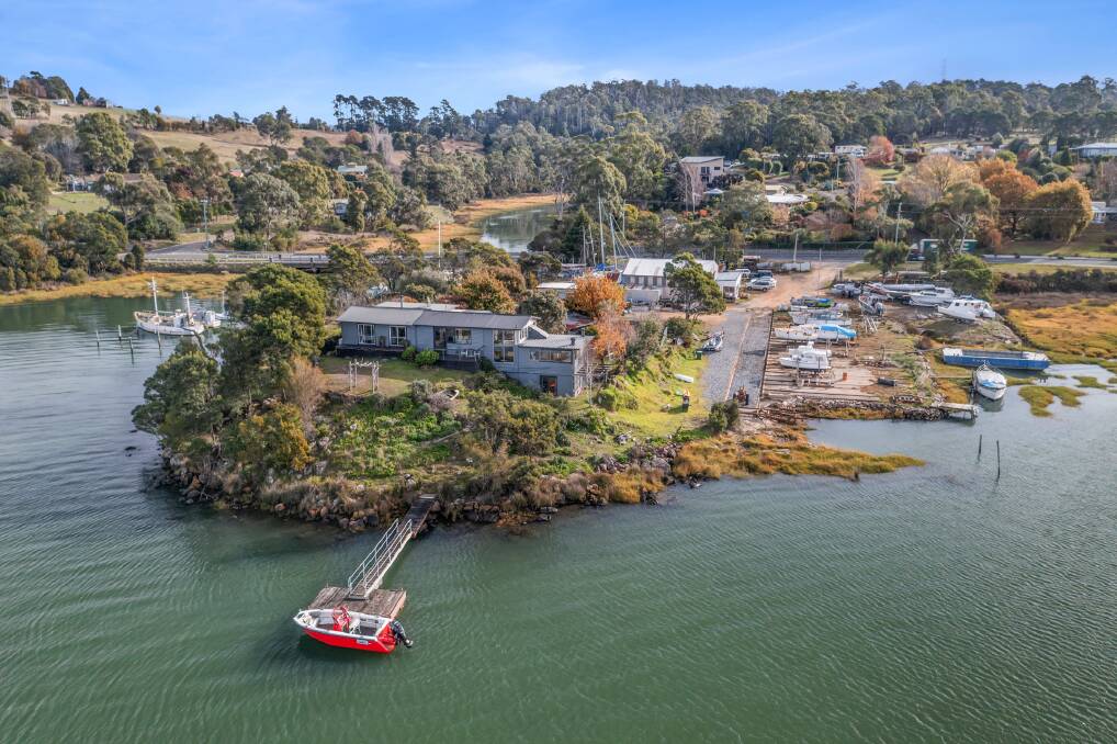 A five-bedroom home is hidden from the road by bushland, and opens out onto a jetty. Picture supplied