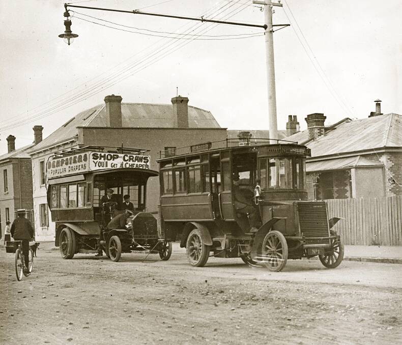 The Newstead steam bus comes to the aid of a Milnes Daimler petrol bus that has broken down in 1906. Picture by Launceston Library, LPIC101-1-32
