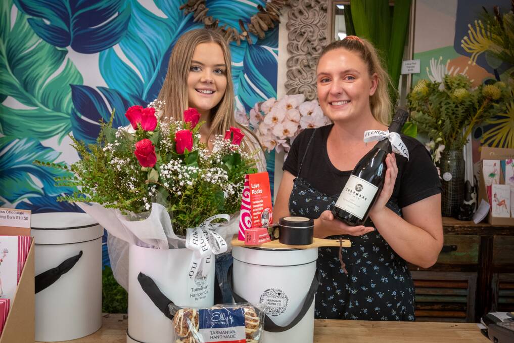 ON OFFER: Hannah Kitto and Ebony Spangaro from Florage with one of the hampers available this Valentine's Day. Picture: Paul Scambler