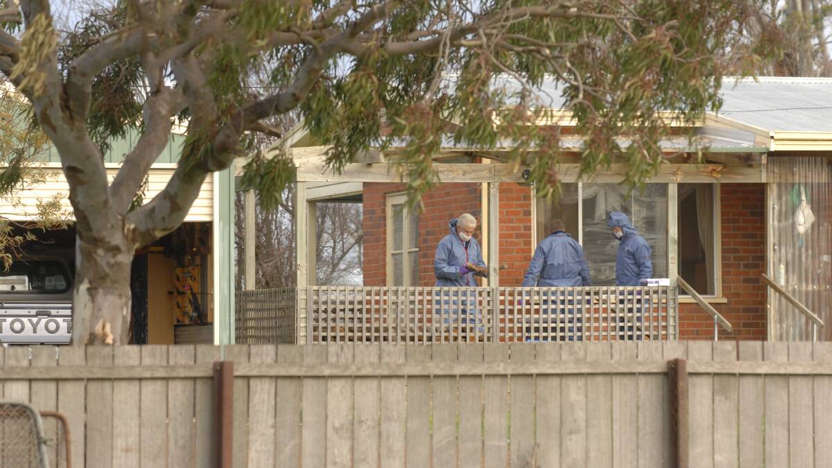 Forensic officer's investigating the death of Shane Barker in 2009