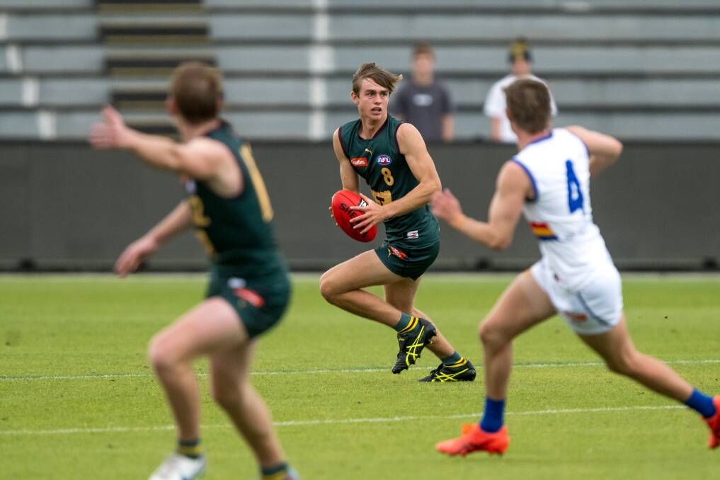 Former Tasmanian Devils' player James Leake in action at UTAS Stadium last year. The Devils wear the map logo. Pictures by Phillip Biggs 