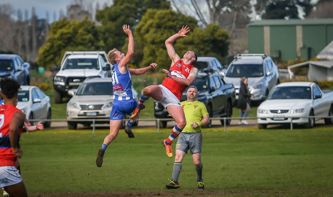 South Launceston's Cody Lowe and Deloraine's Coby Cook contest the ruck during the Deloraine MND Big Freeze game in 2023. 