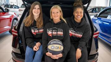 Launceston Tornadoes imports Lore Devos and Trinity Oliver with coach Sarah Veale (middle) at Buckby Skoda earlier this year. Picture by Paul Scambler 