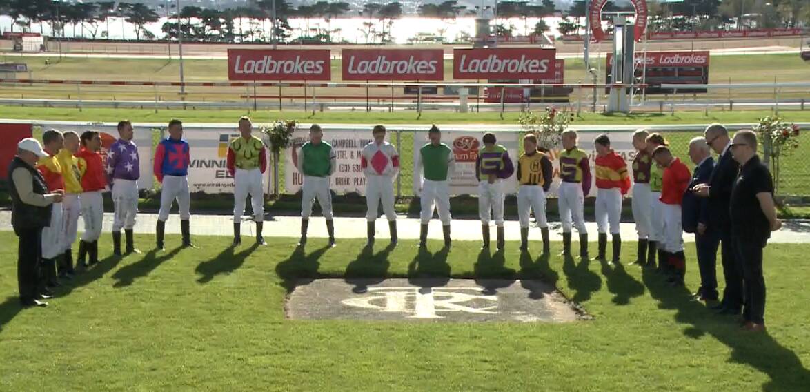 Jockeys pay their respects during the minute's silence for Dean Holland at Elwick on Sunday.