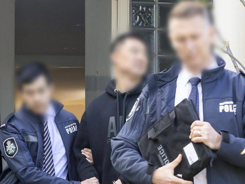 AFP officers arrested seven people accused of money laundering in raids across the nation. (HANDOUT/AUSTRALIAN FEDERAL POLICE)