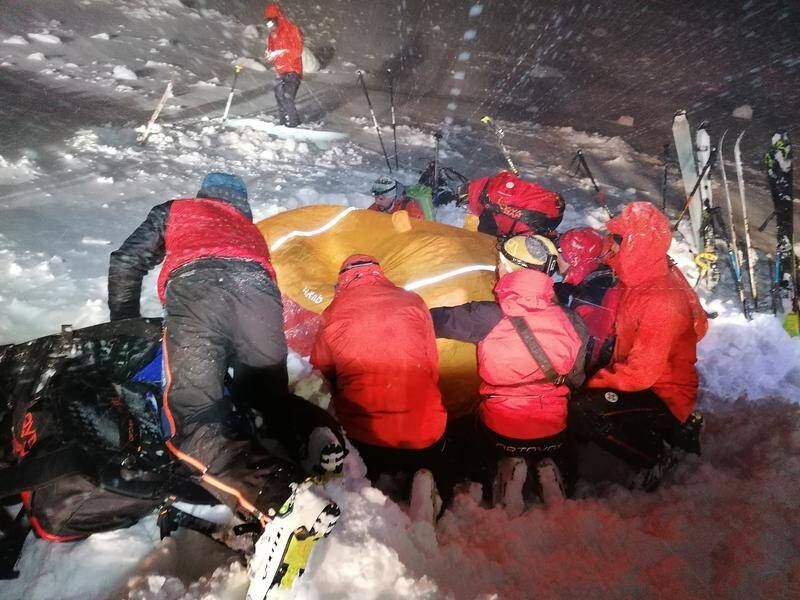 Rescue operations are under way to find skiers buried by avalanches at Austrian and Swiss resorts.