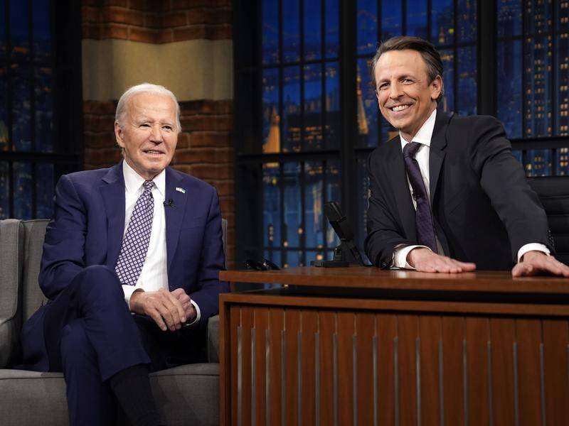 President Joe Biden talks joined Seth Meyers for the 10th anniversary of his late-night talk show. (AP PHOTO)