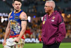 Lions coach Chris Fagan (R) is expecting a hard tag from the Saints on midfielder Lachie Neale (L). (Morgan Hancock/AAP PHOTOS)