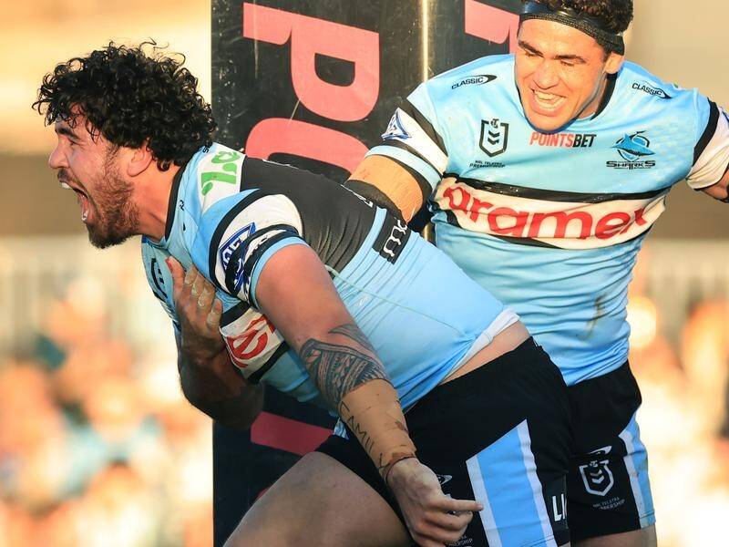 Braden Hamlin-Uele (l) rejected better offers to remain at Cronulla for another two seasons. (Mark Evans/AAP PHOTOS)