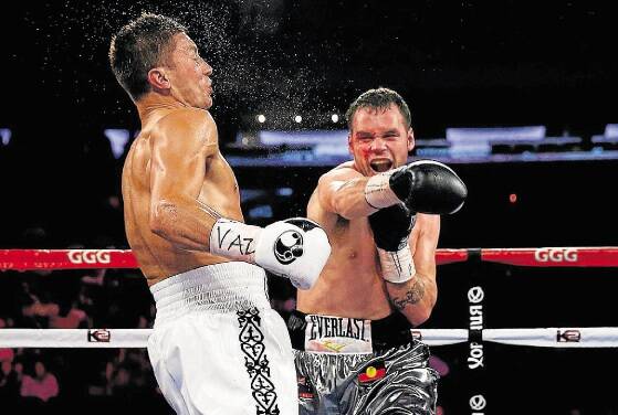 Daniel Geale punches Gennady Golovkin during the  WBA/IBO middleweight championship bout at Madison Square Garden.