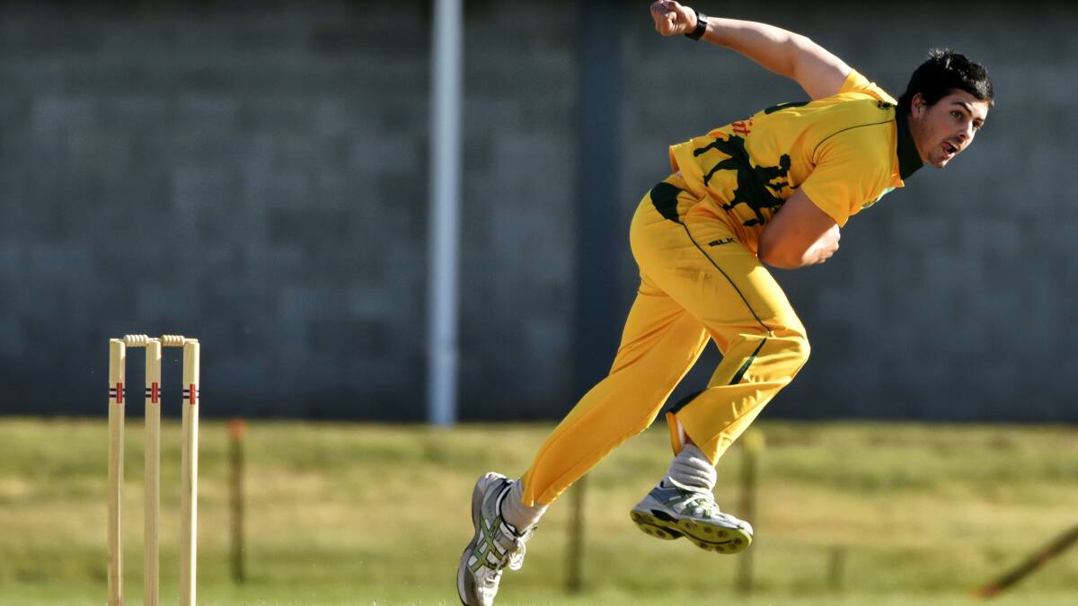 South Launceston’s  Alex Treanor  charges in to bowl in his side’s T20 clash against George Town on Thursday night. Picture: SCOTT GELSTON