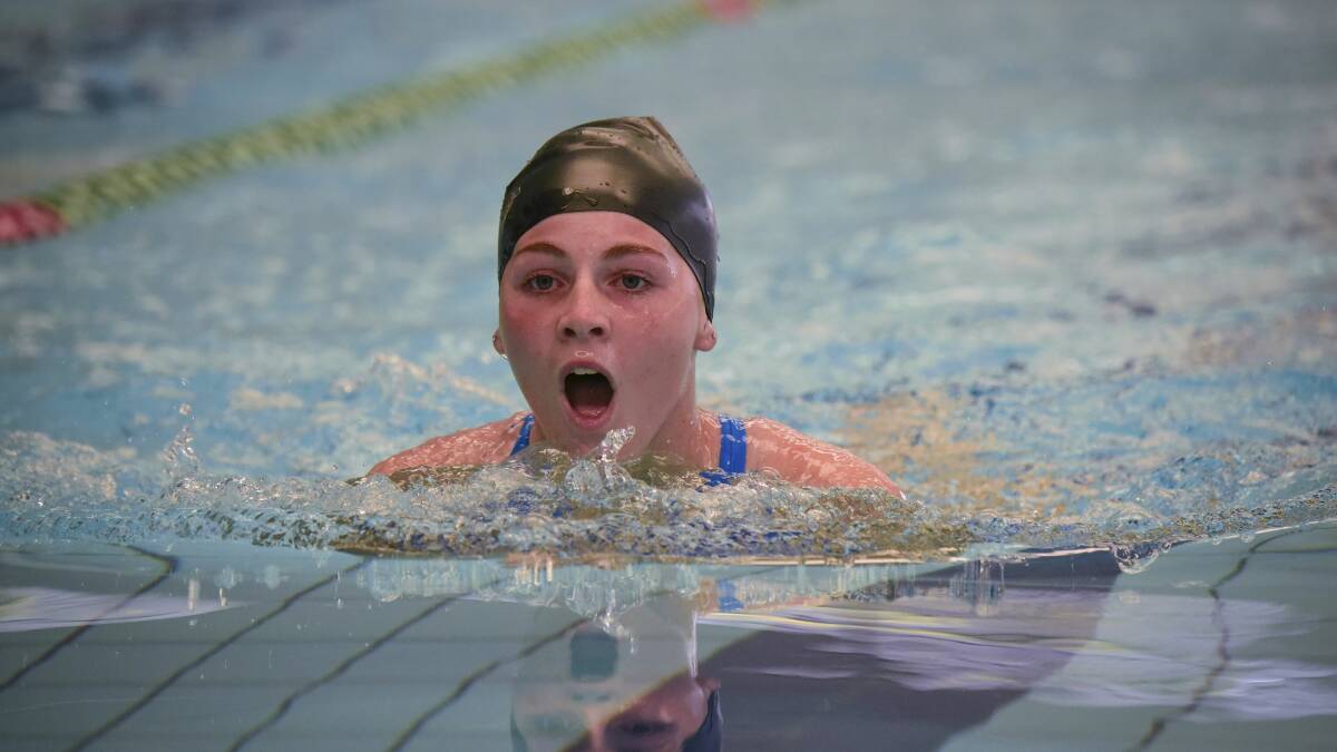 BLACK CAP: Amy Duke, of St Helens, on Thursday shows off a textbook breaststroke action during the popular carnival action.