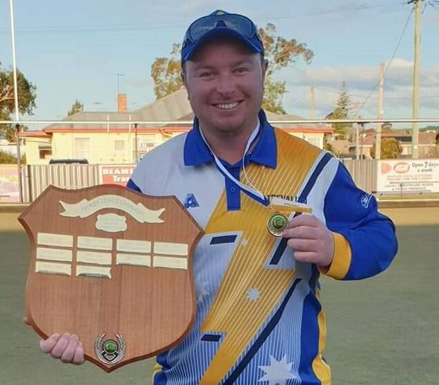 Bowled over: Trevallyn's Michael Sims with Bowls Tasmania's 2021 Men's Bowler of the Year Award. Picture: Facebook
