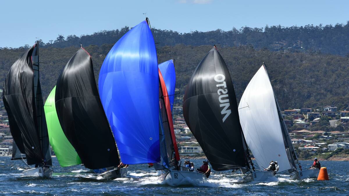 SAIL NOW ON: The SB20 fleet on the River Derwent in Hobart.