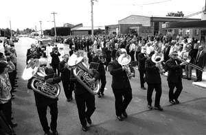 ON THE MARCH: The Latrobe Federal Band leads the funeral down Gilbert St, where 1500 people lined the street. Pictures: WILL SWAN. (1/2)
