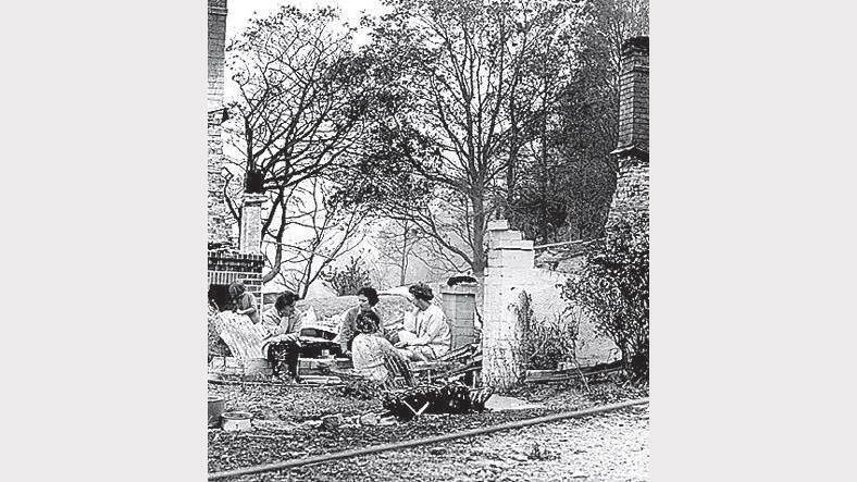 1967 Bushfires: The Coombe family picnics in the ruins of their Hobart home.
